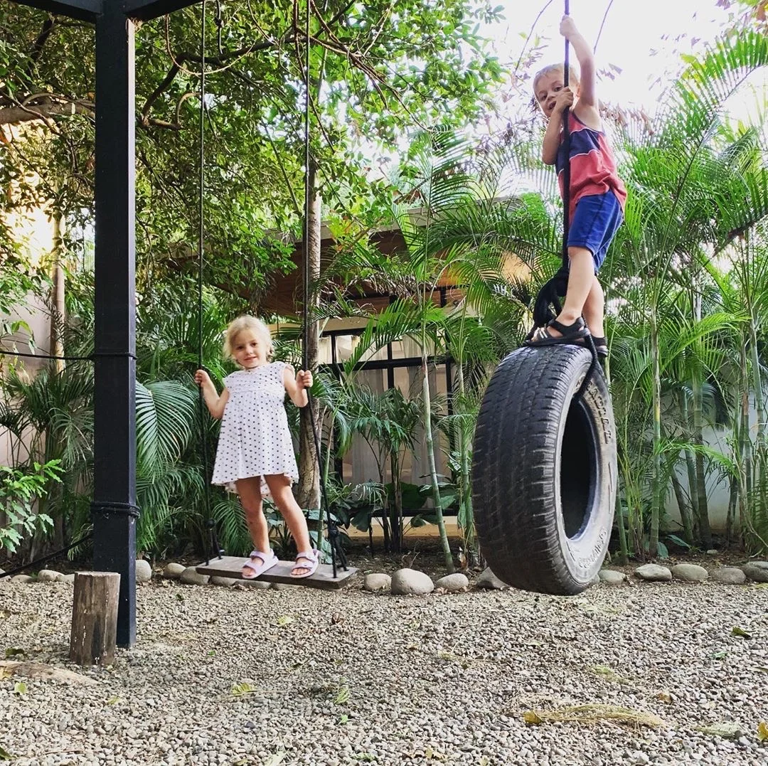 Kids on the playground at Nalu Nosara